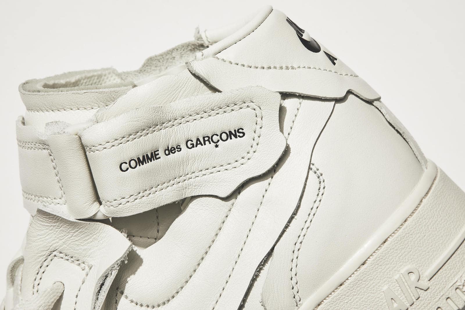 Comme des Garcons x Air Force 1 Mid Triple White Sneakers