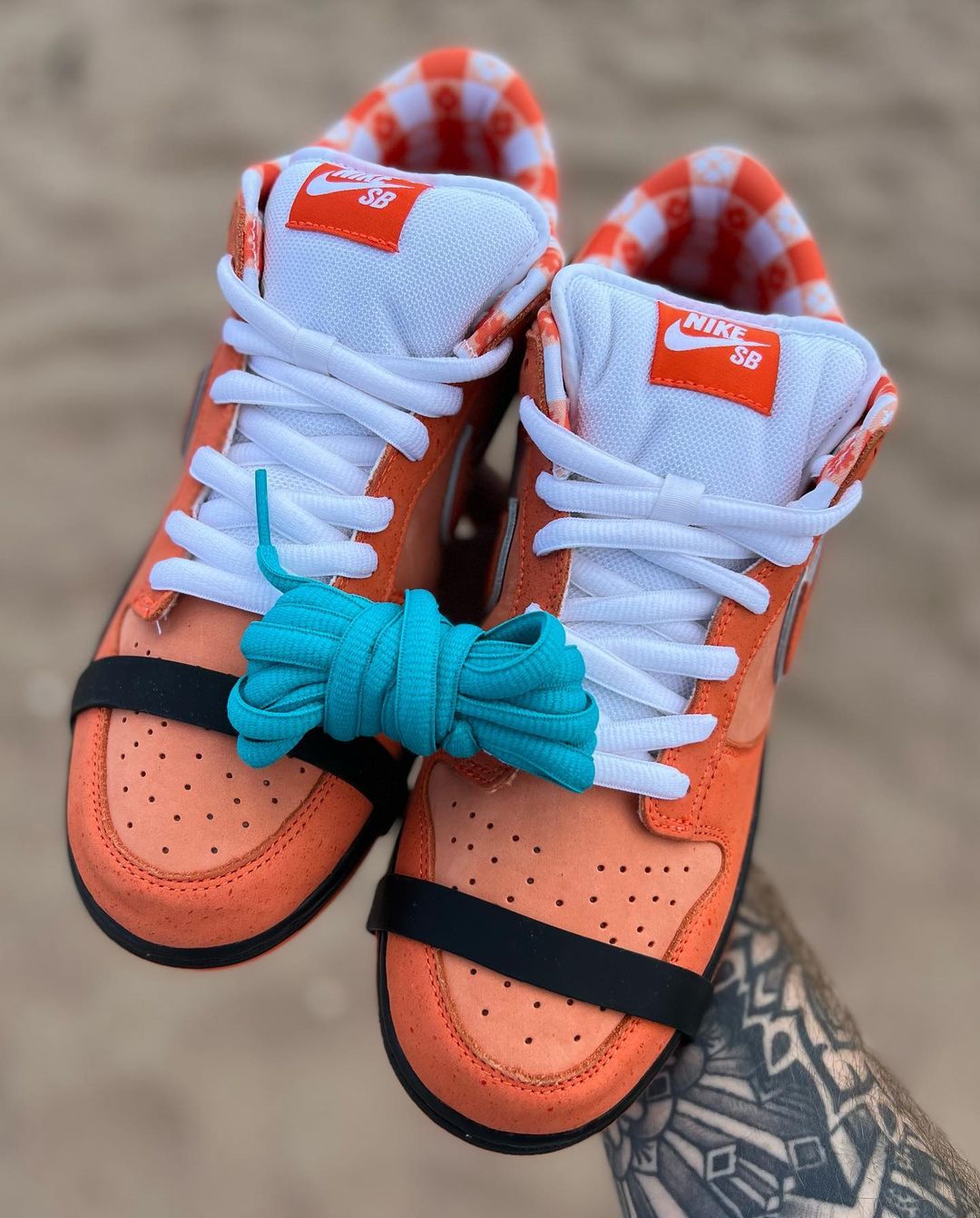 blue dunks with orange laces