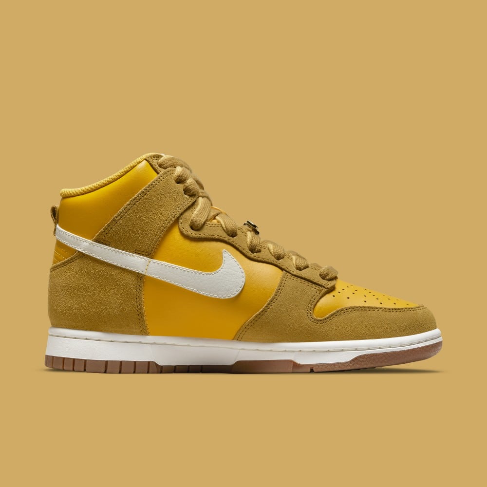 gold swoosh nike shoes