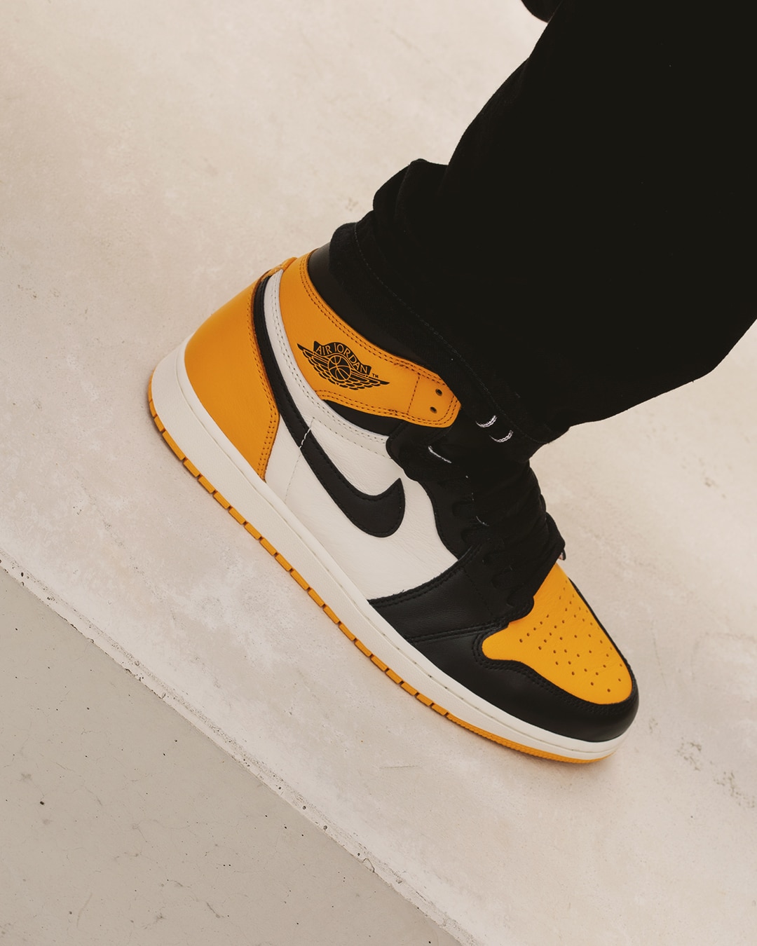 jordan 1 black and yellow on feet