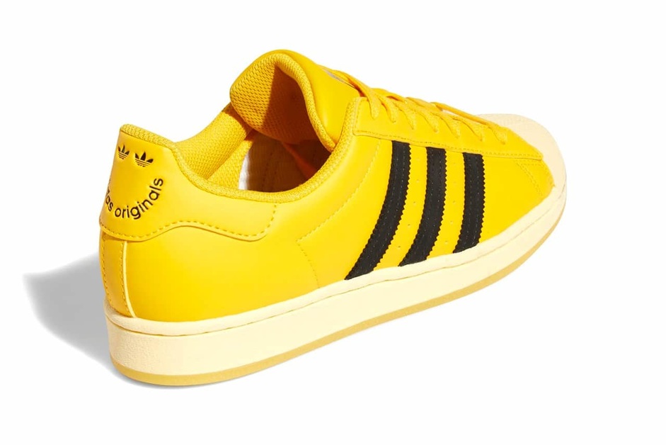 Adidas originals women's superstar sneaker yellow hotsell