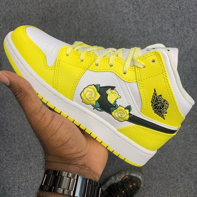 An Air Jordan 1 Mid with Yellow Flowers