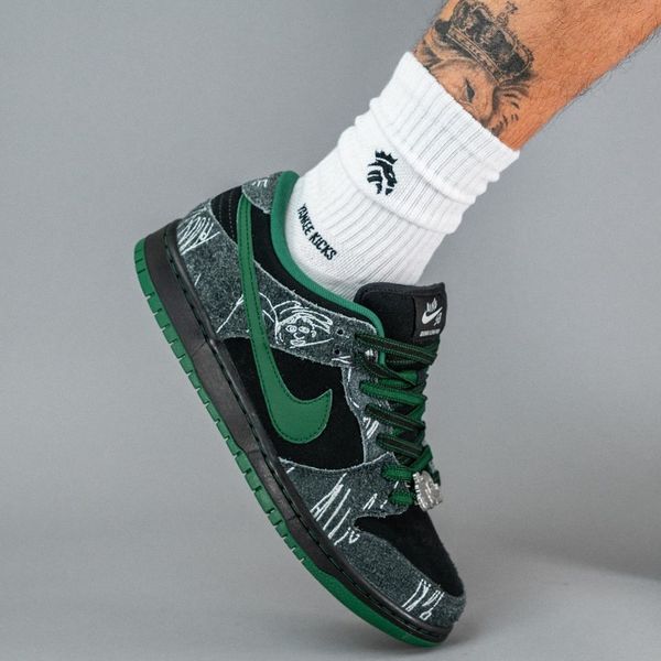 There Skateboards Nike SB Dunk Low On Feet