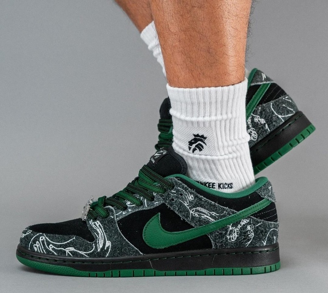 There Skateboards Nike SB Dunk Low On Feet 4